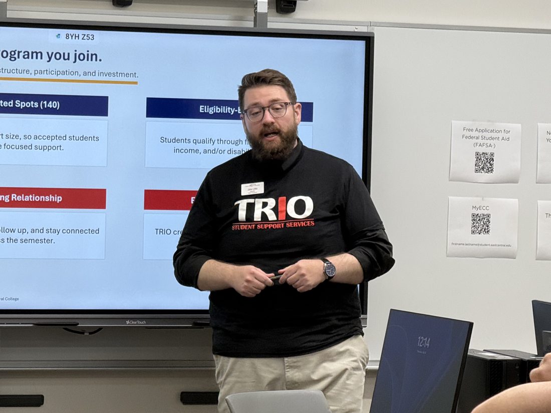 Jacob Little presenting in front of a slide titled TRIO is a program you join